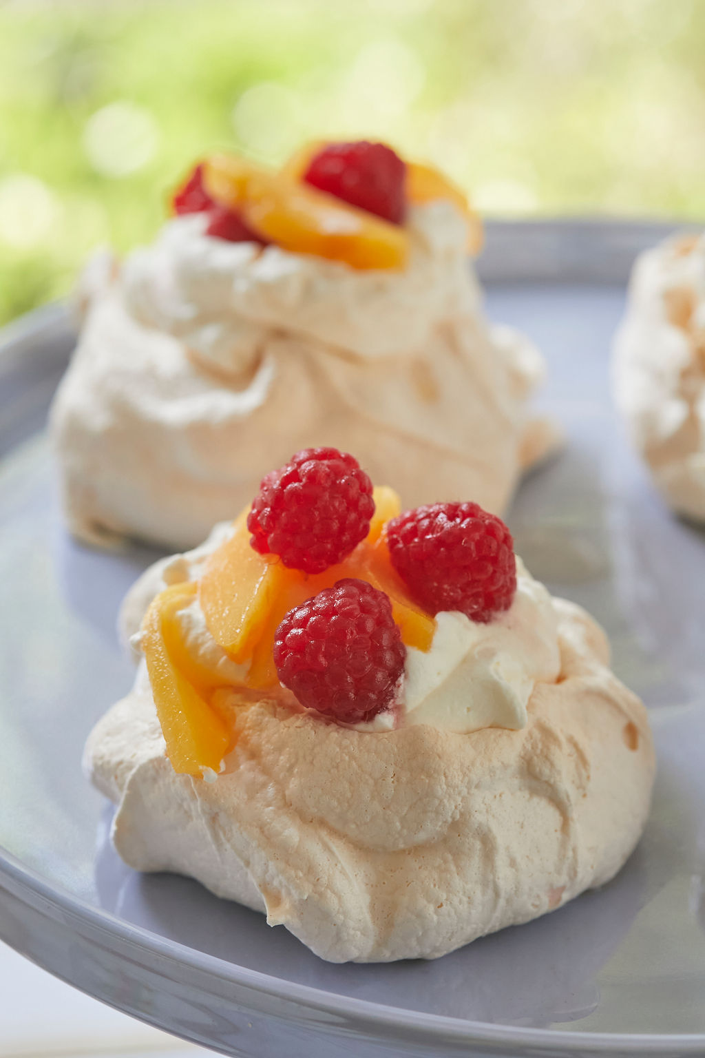 A perfect little meringue, topped with fresh cream and fruit.