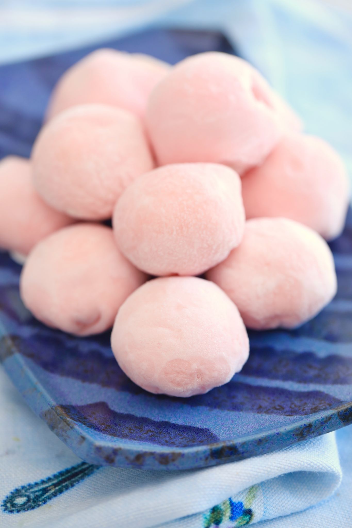 My finished Japanese Mochi Ice Cream recipe, pink, and stacked high.
