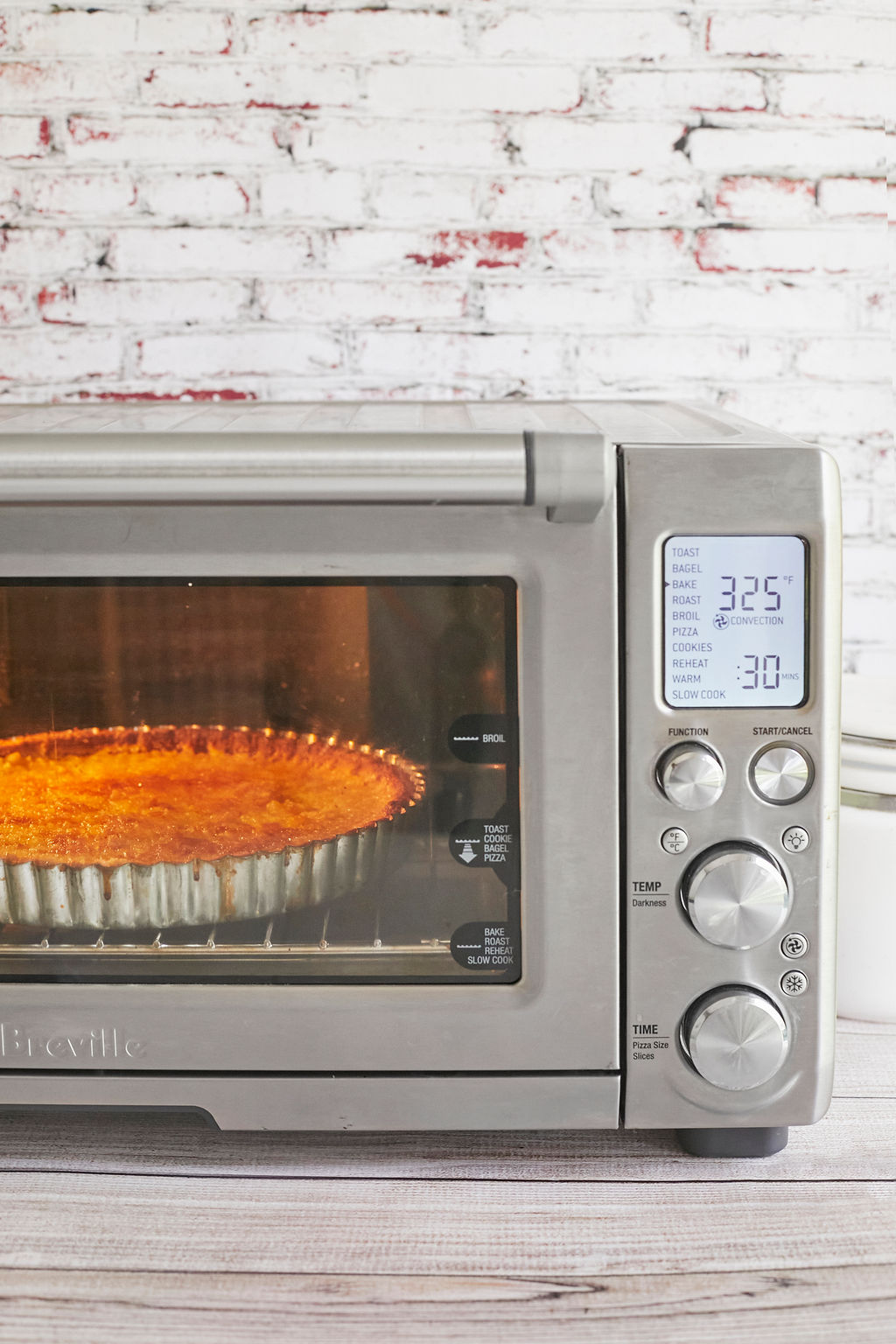 An OTG, or toaster oven, baking a tart.