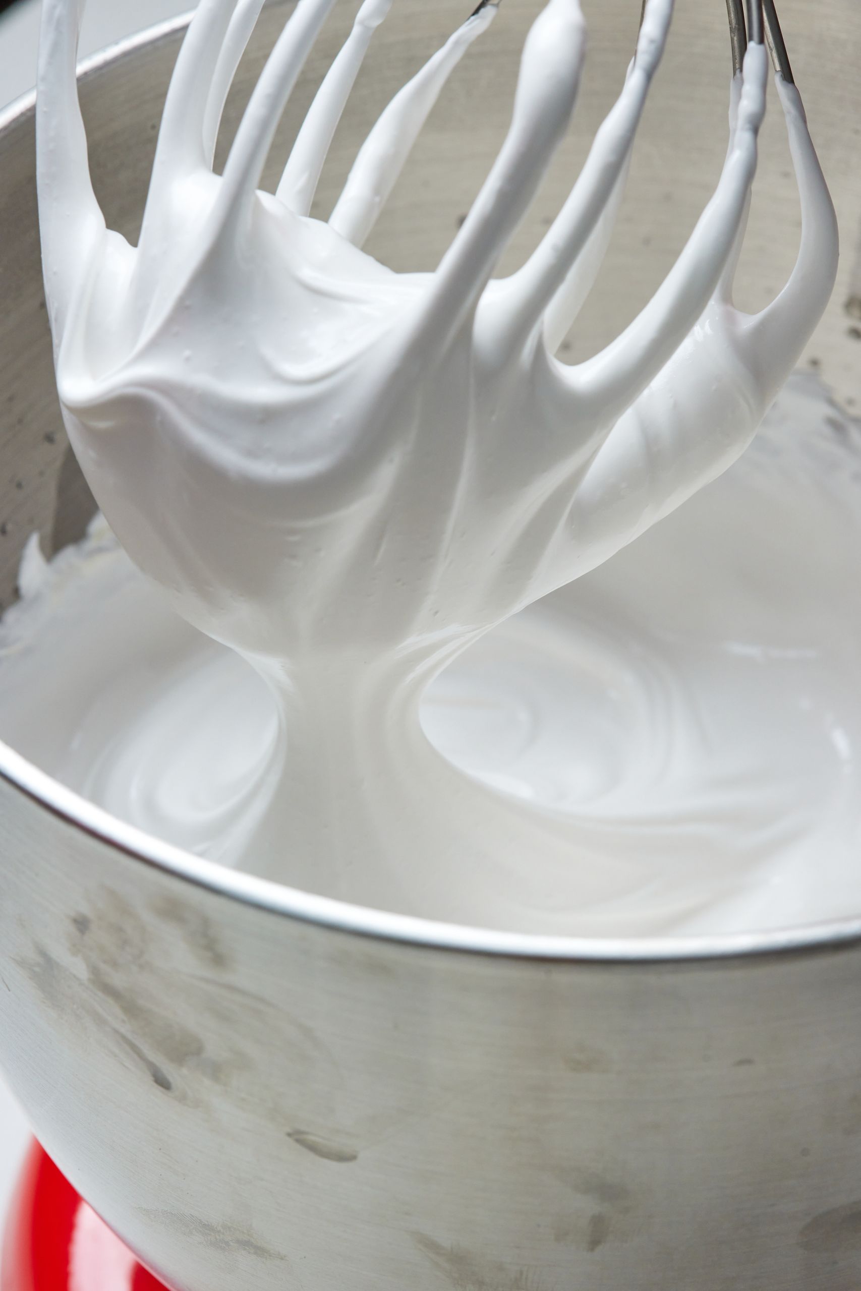 Add sugar gradually and whip up egg whites to stiff peaks. 