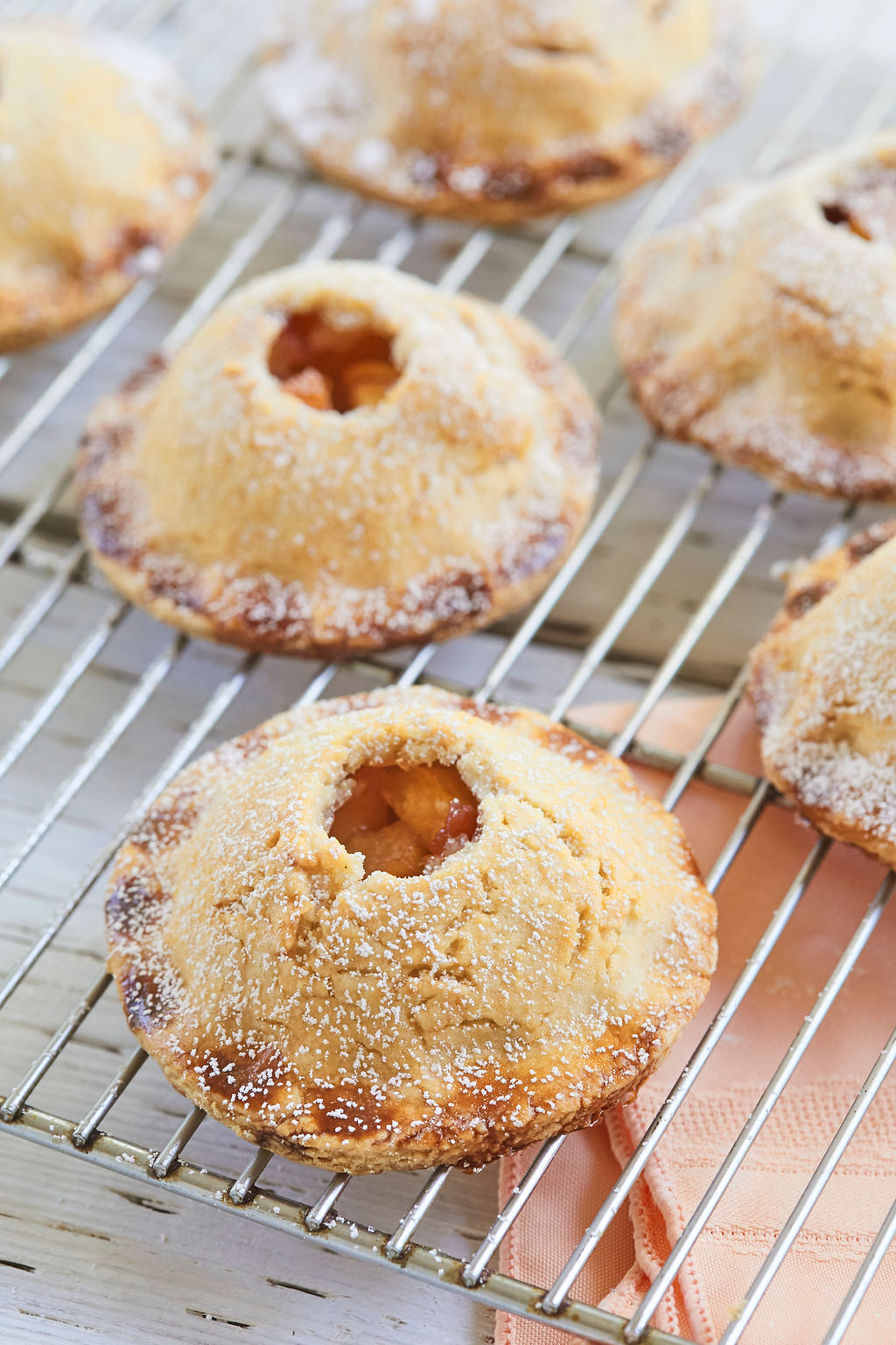 Peach Hand Pies dusted with powdered sugar.