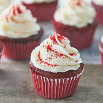 A group of red velvet cupcakes topped with frosting