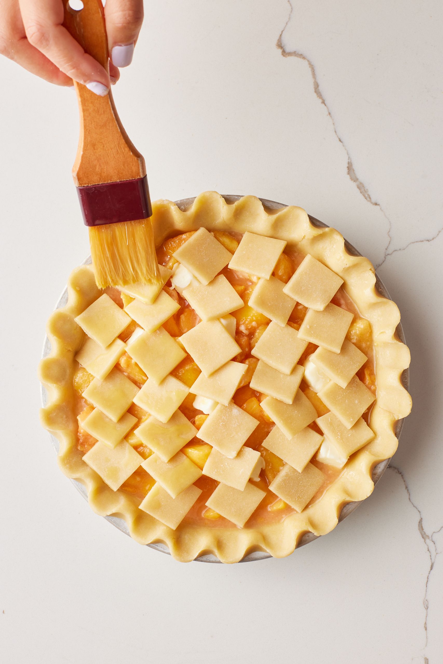 Brush the top squares of crust with egg wash
