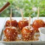 A tray of finished caramel apples.