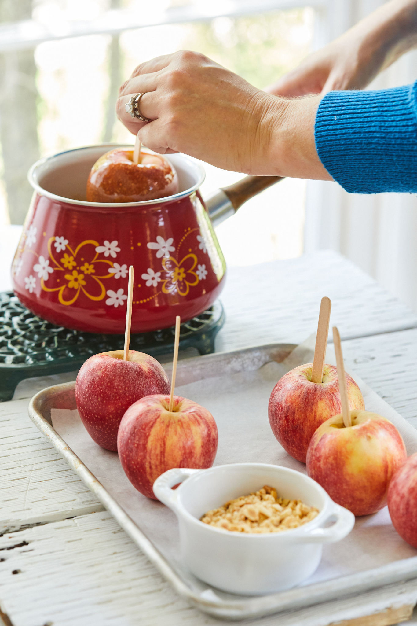 A tray of apples ready to dip into caramel.