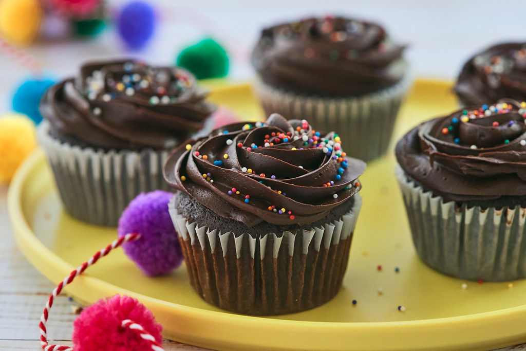 A plate of chocolate cupcakes.