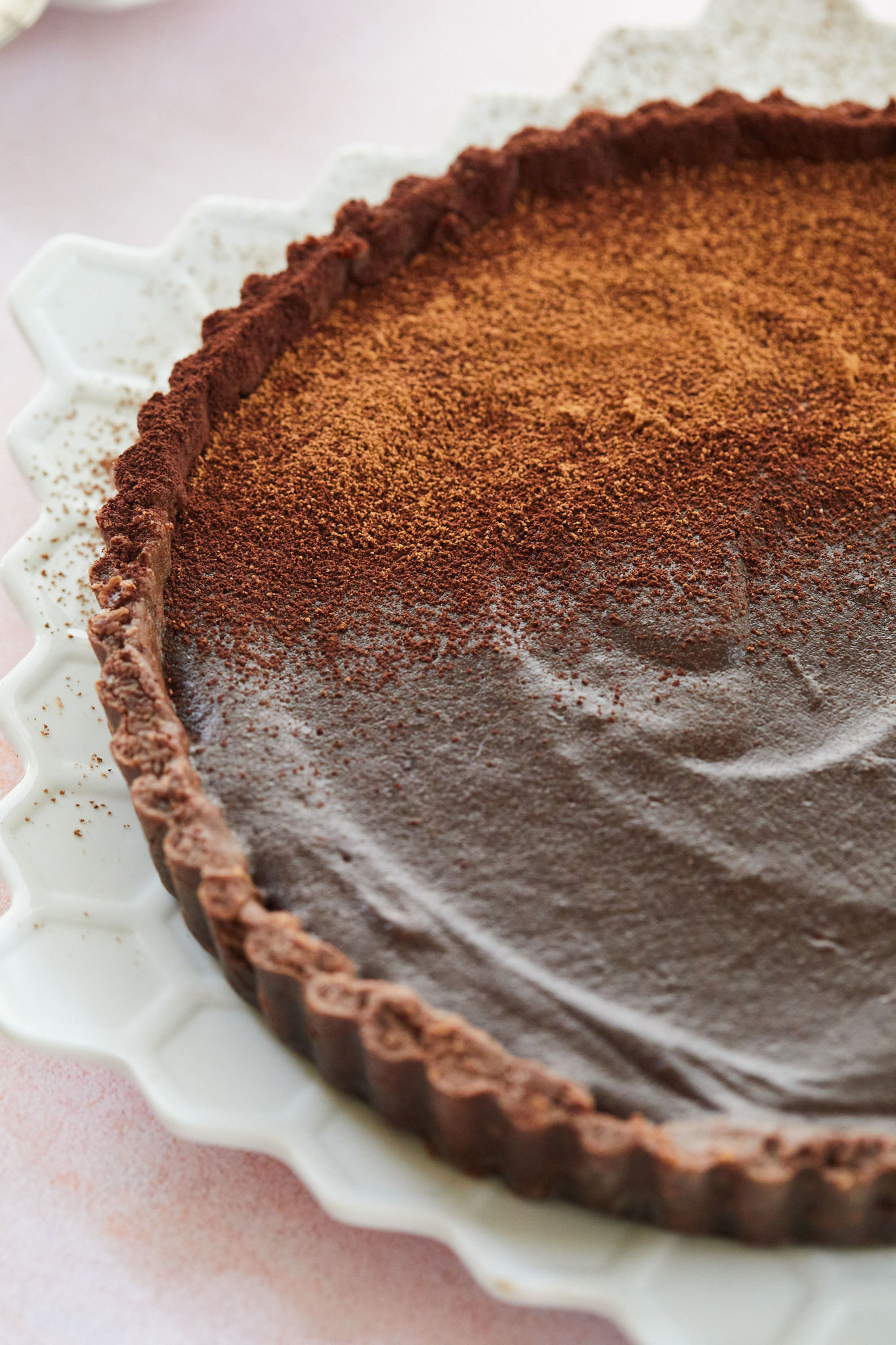 My Chocolate Tart recipe dusted with cocoa powder.