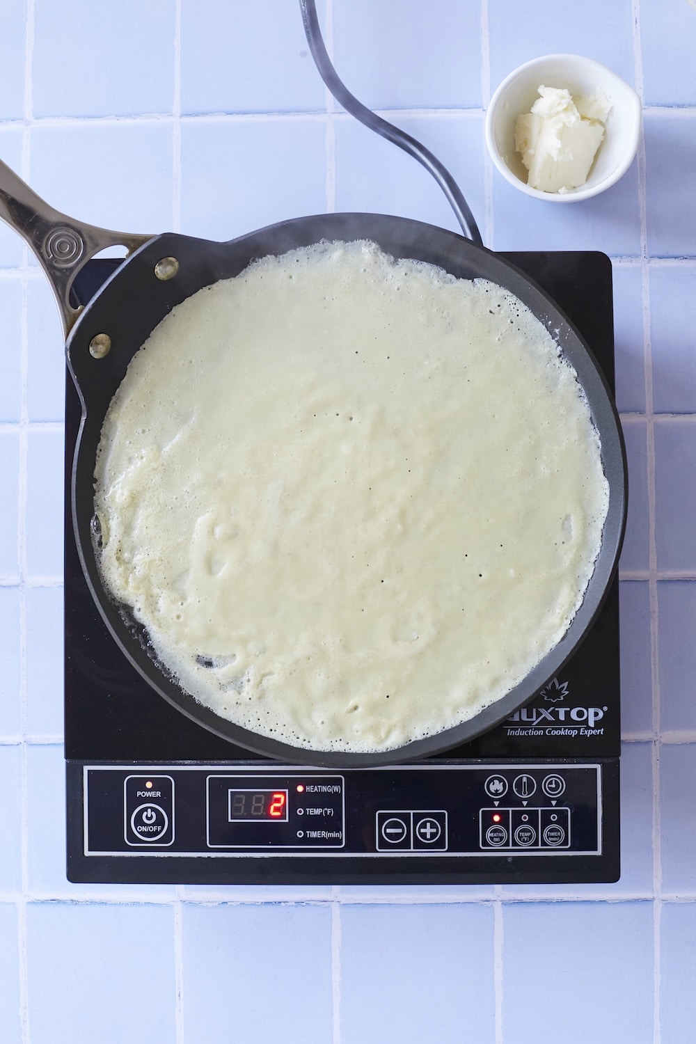 Cook the first side until small bubbles appear on the surface.