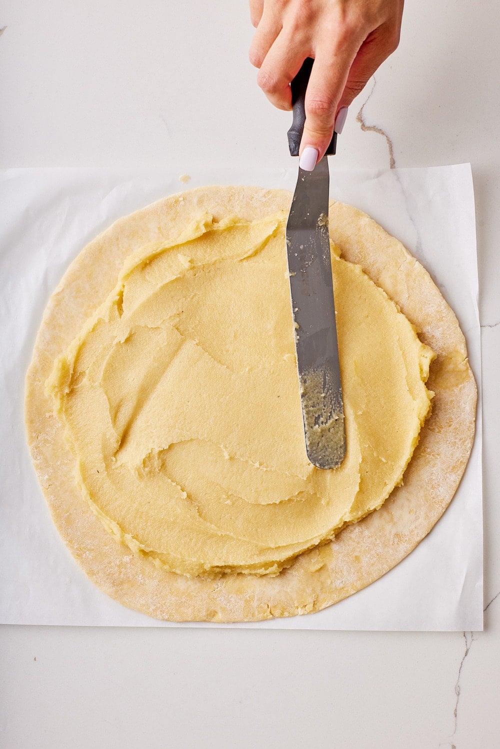 Rustic Fruit Galette3 Spread the frangipane filling in the center of the dough, leaving a 3-4-inch (9 cm) border all around.