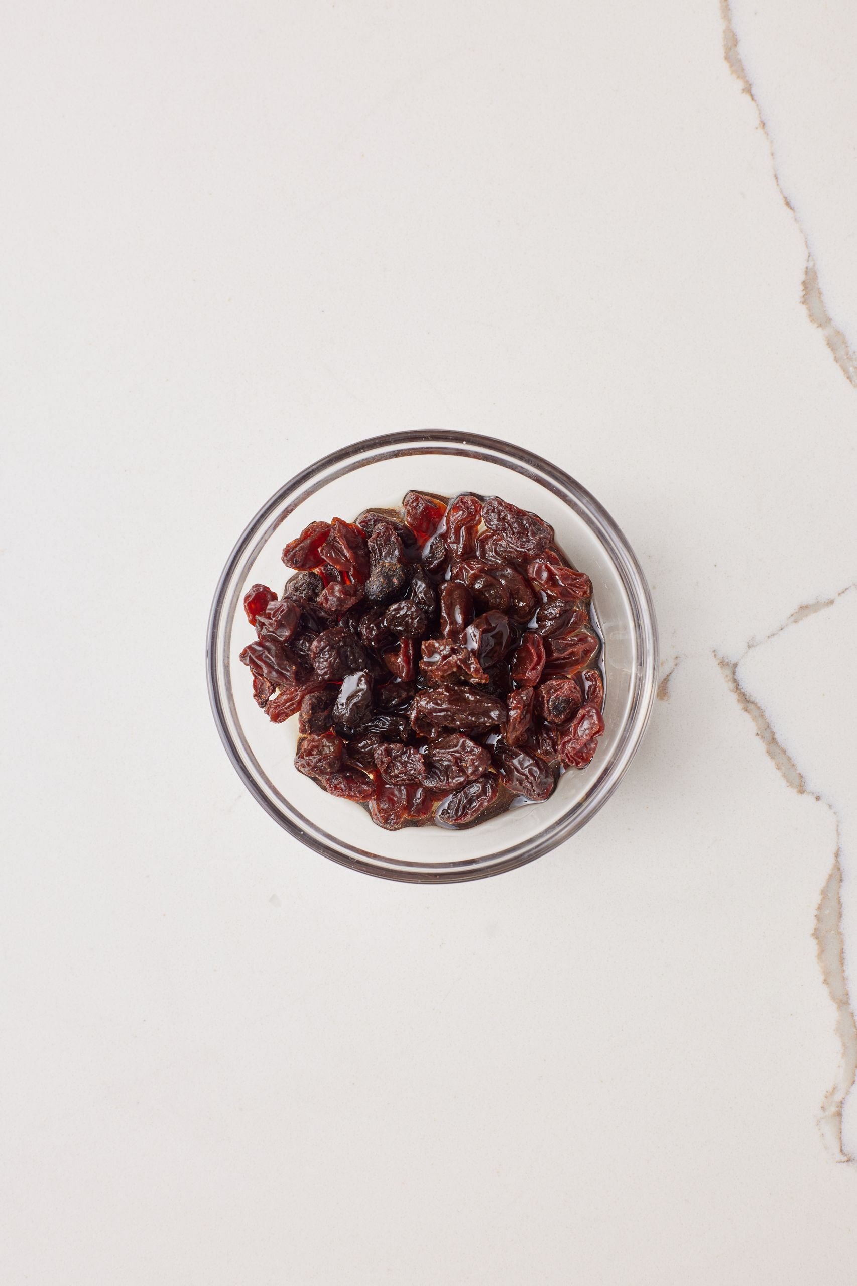 Step-by-step instructions on how to make Easy Apple Strudels : soak the raisins.