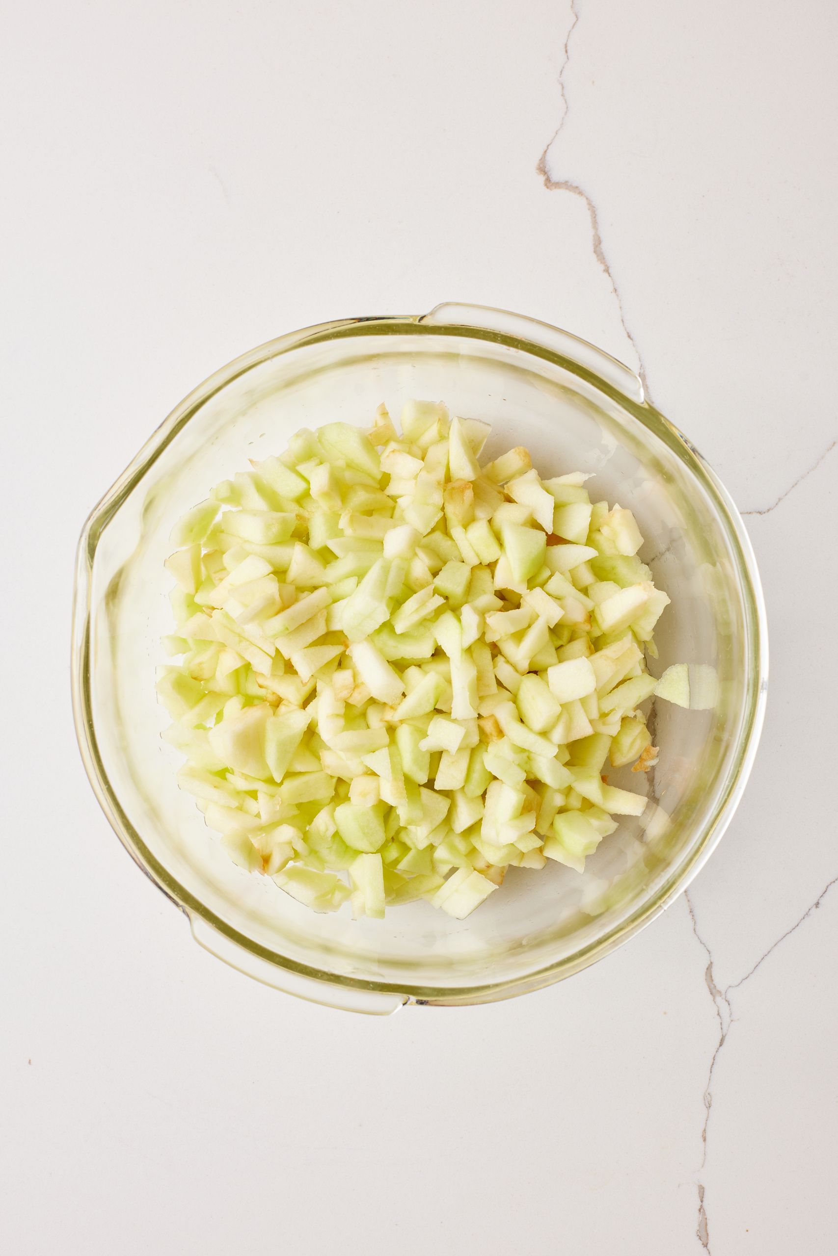 Peel, core, and chop the apples into roughly ½-inch squares.