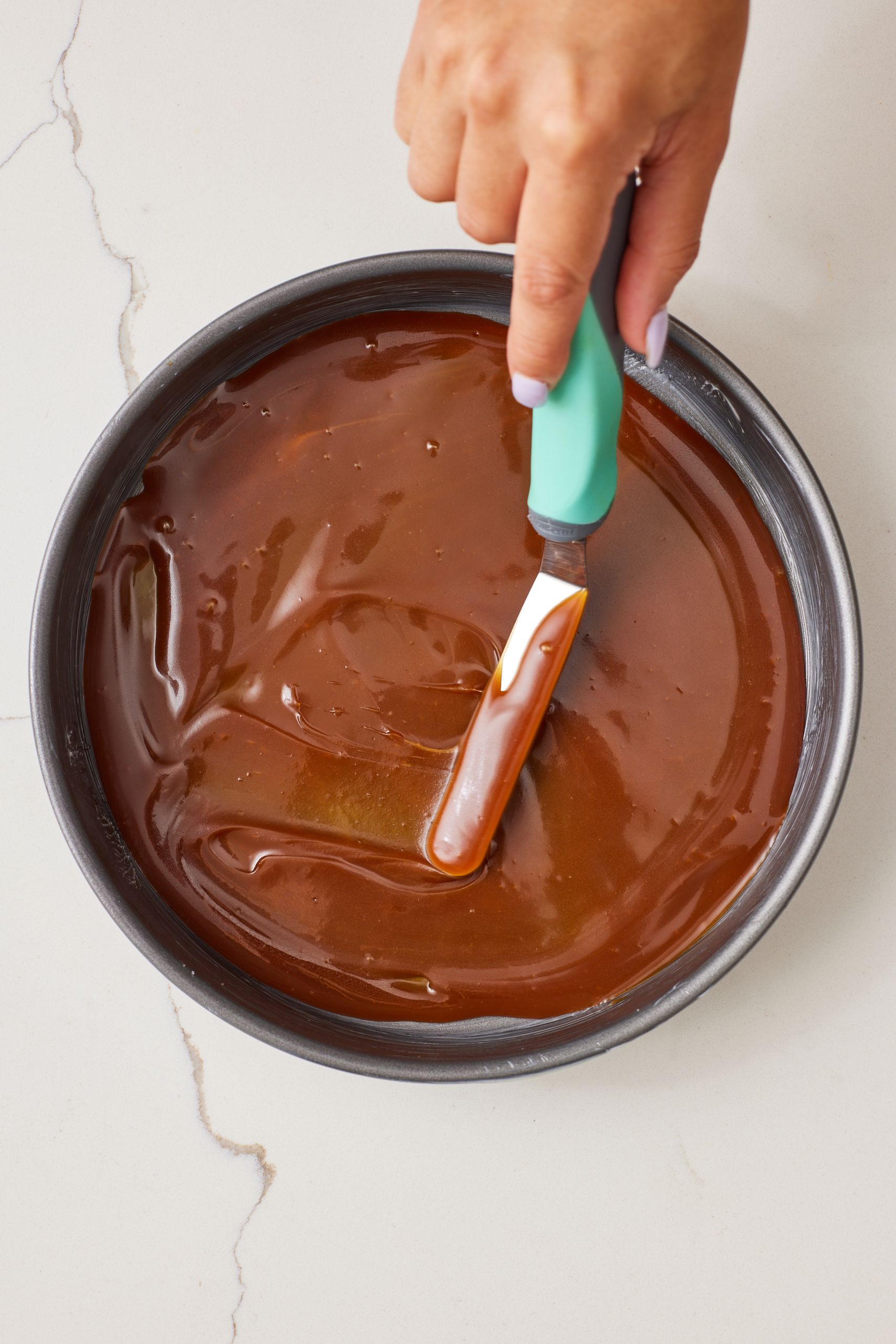 Caramel Apple Upside Down Cake2 Step-by-step instructions on how to make caramel apple upside down cake: Pour your salted caramel sauce into the buttered pan and spread evenly over the bottom and up the sides.