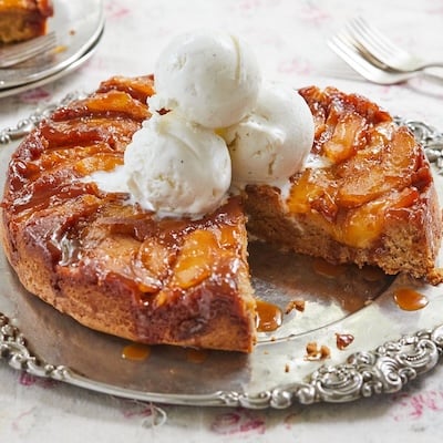 Caramel Apple Upside Down Cake topped with ice cream.