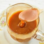 Caramel Rum Sauce recipe being spooned.