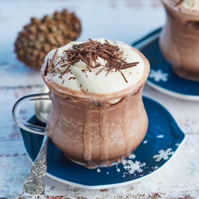 Frozen Hot Chocolate is rich and topped with whipped cream and chocolate shaves.