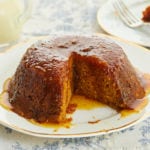 Treacle Pudding with a slice taken out of it.