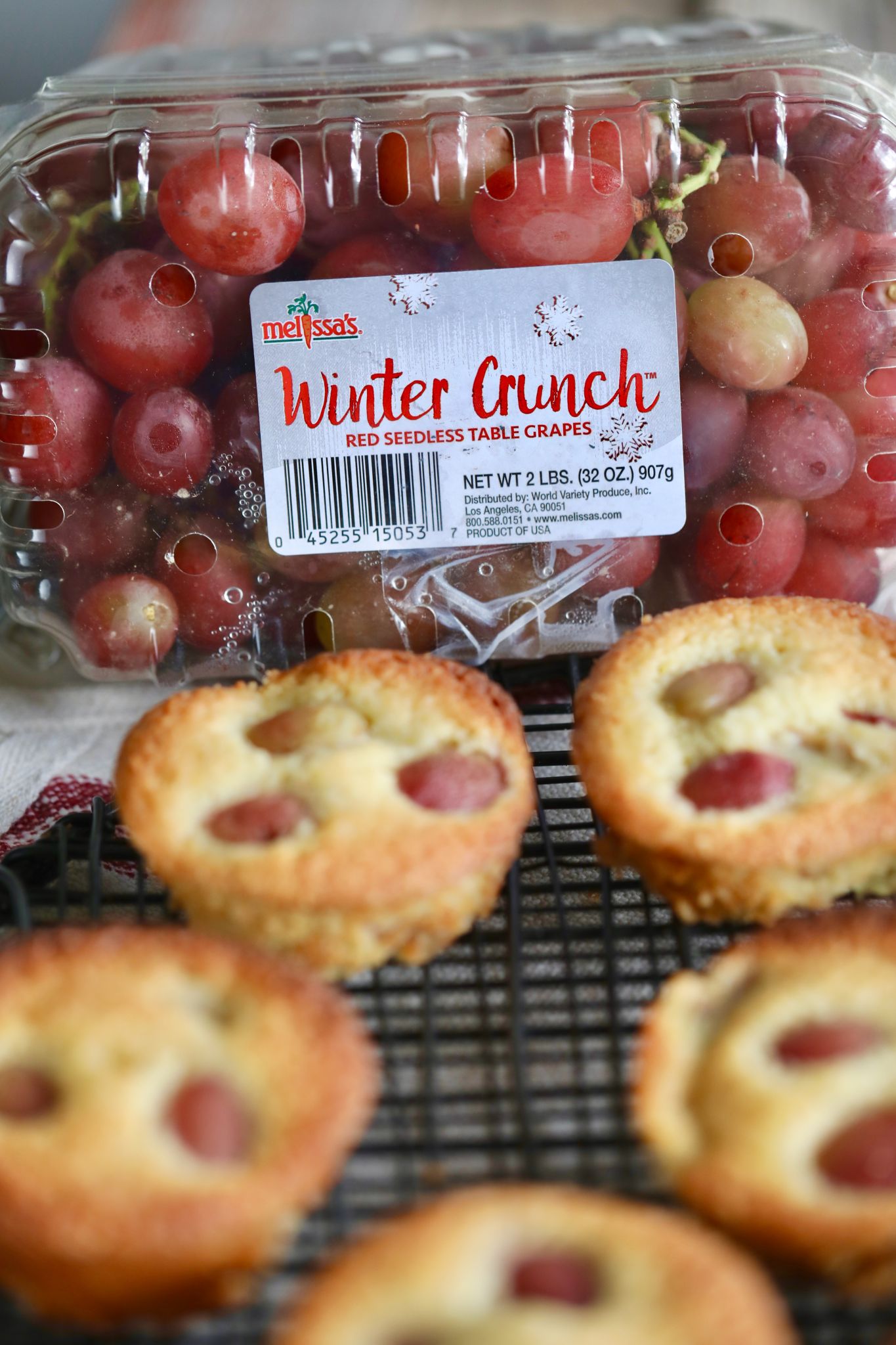 Winter Crunch Grape and Almond Cakes in front of a box of Winter Crunch Grapes.