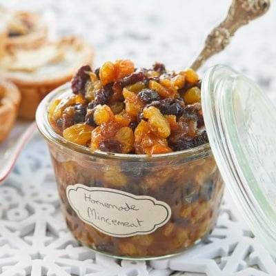 A glass jar of traditional mincemeat recipe with spiced raisins, currants, sultanas, and candied peels. They're plumped up and infused with Whiskey.
