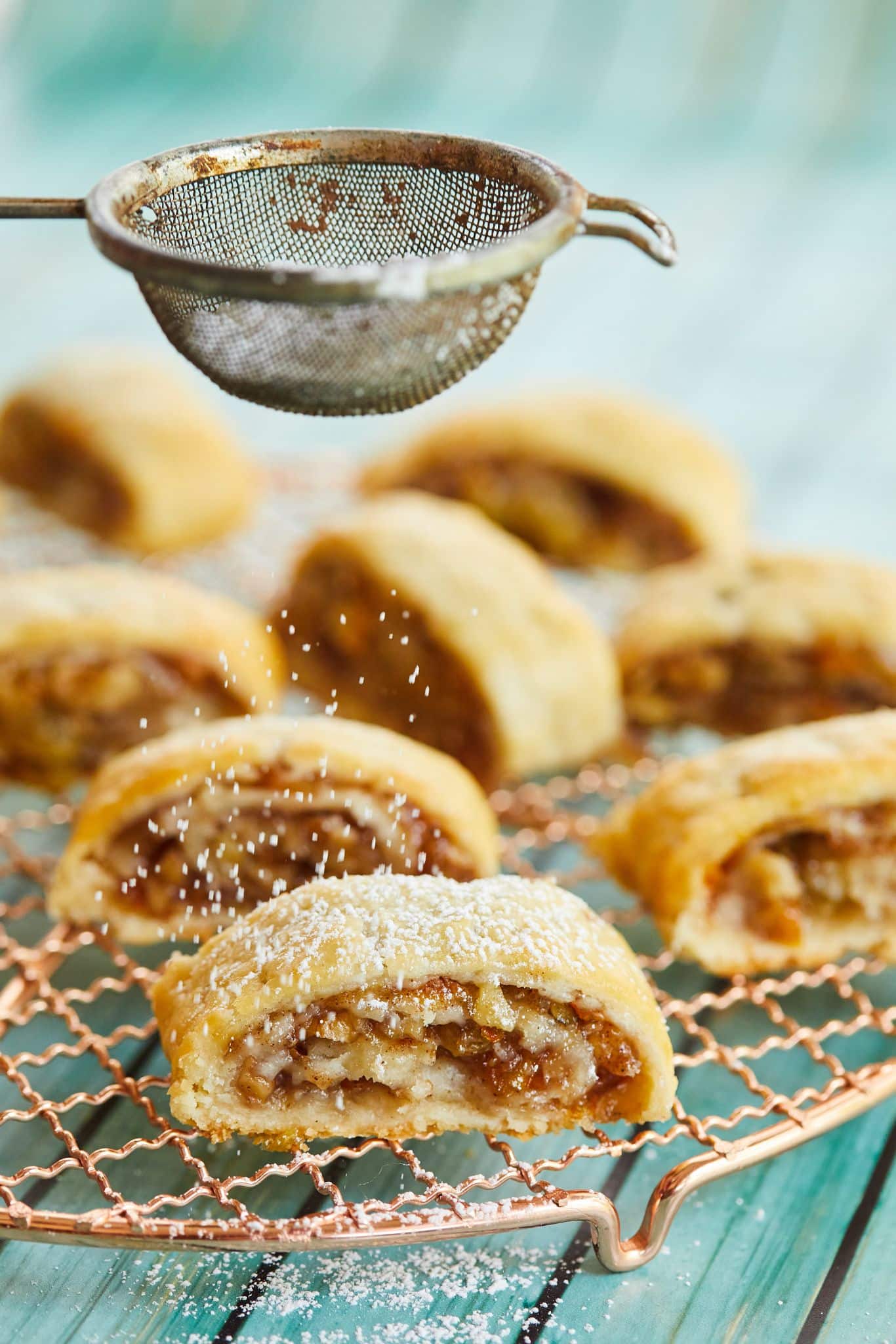 Dusting rugelach with powdered sugar. 