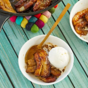 My bananas foster recipe served into two bowls with vanilla ice cream.