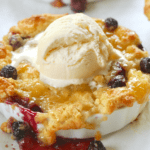 Blueberry & Lemon Curd Bread Pudding topped with vanilla ice cream