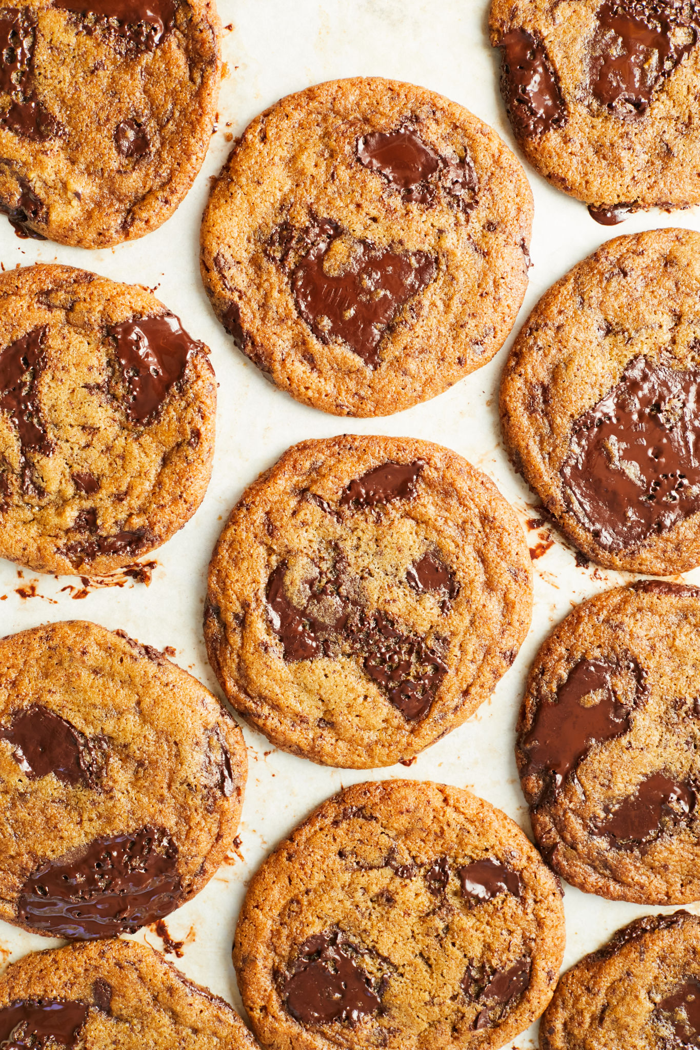A tray of the internet's best chewy chocolate chip cookies, with melted chocolate chunks.
