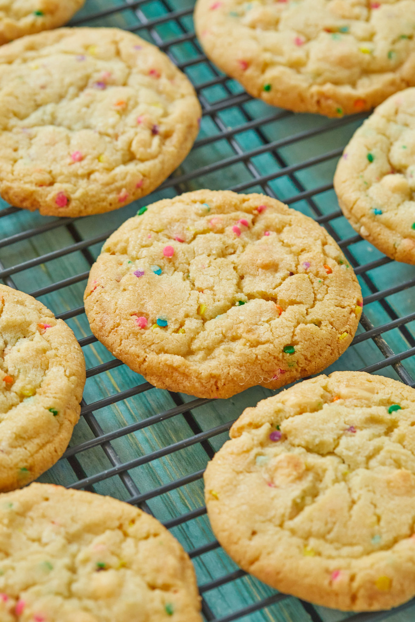 Lots of Funfetti Cookies on a cooling rack.
