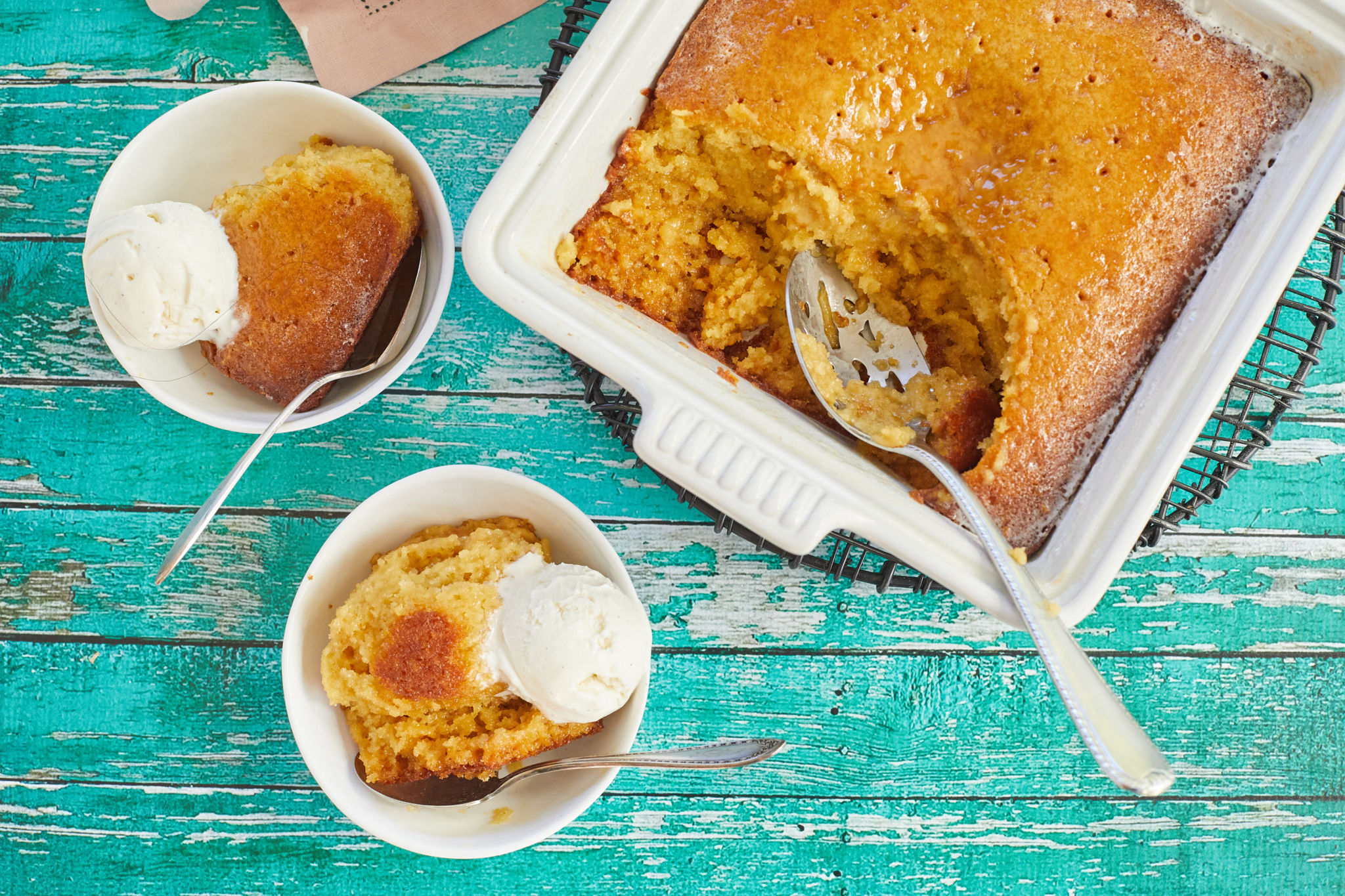 Malva Pudding, or cake, portioned out into two bowls.
