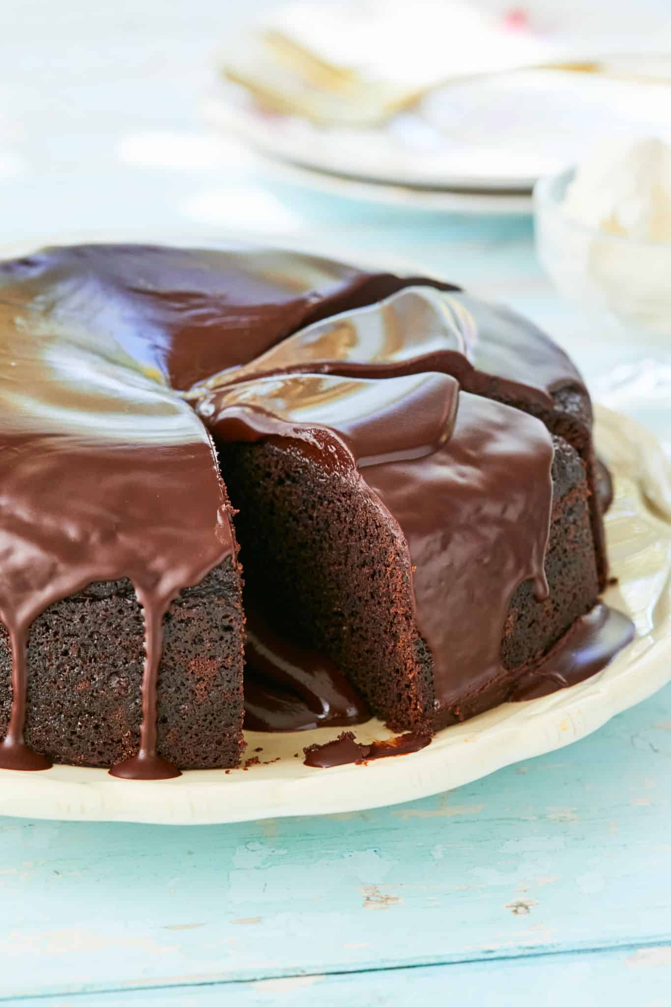 Sliced chocolate Guinness cake, topped with cream cheese frosting.