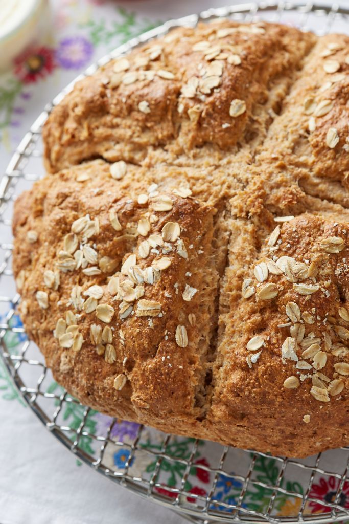 golden rustic soda bread is topped with oats