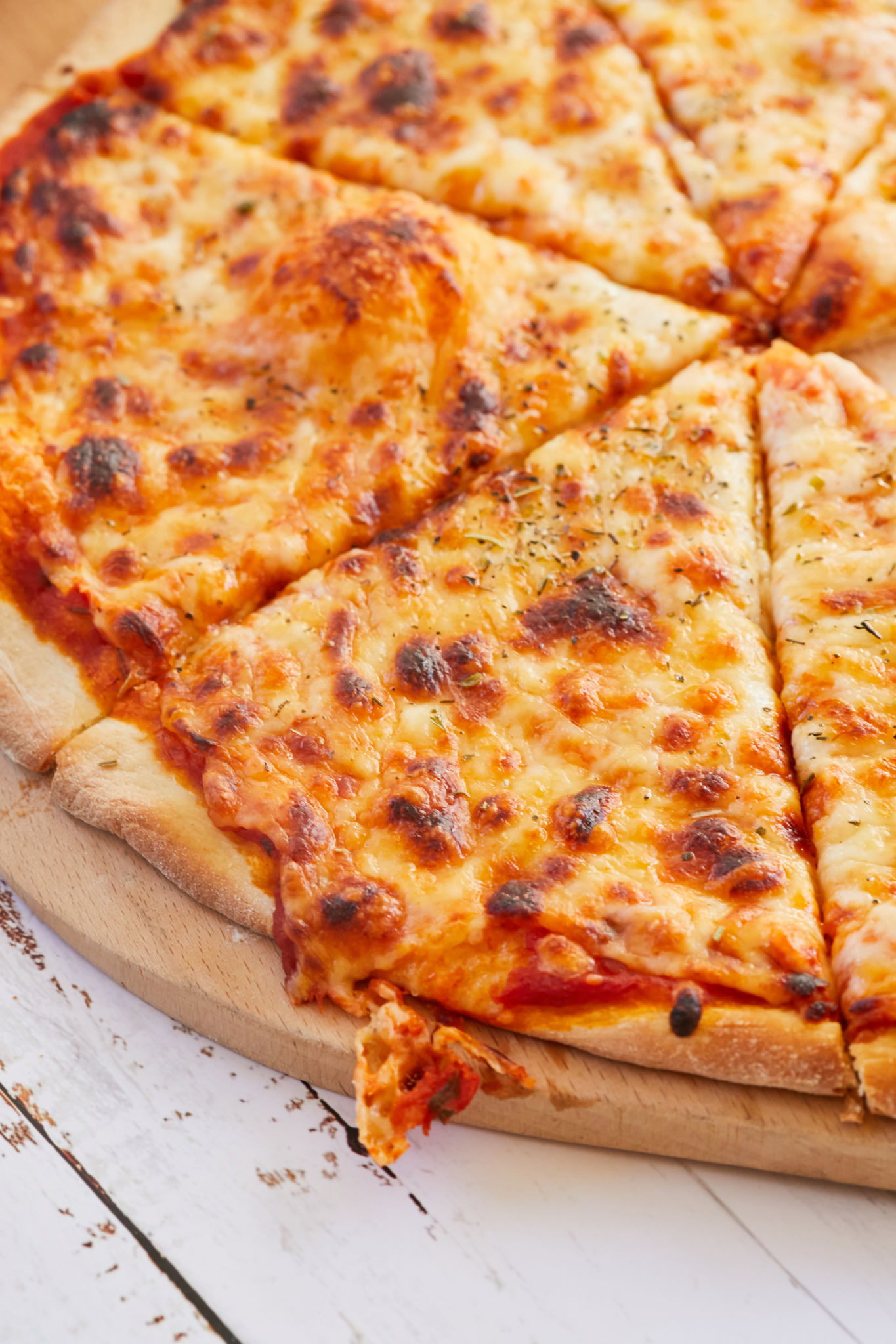 A close up of a slice of homemade NY pizza.