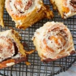 No-Knead Cinnamon Rolls resting on a cooling rack.