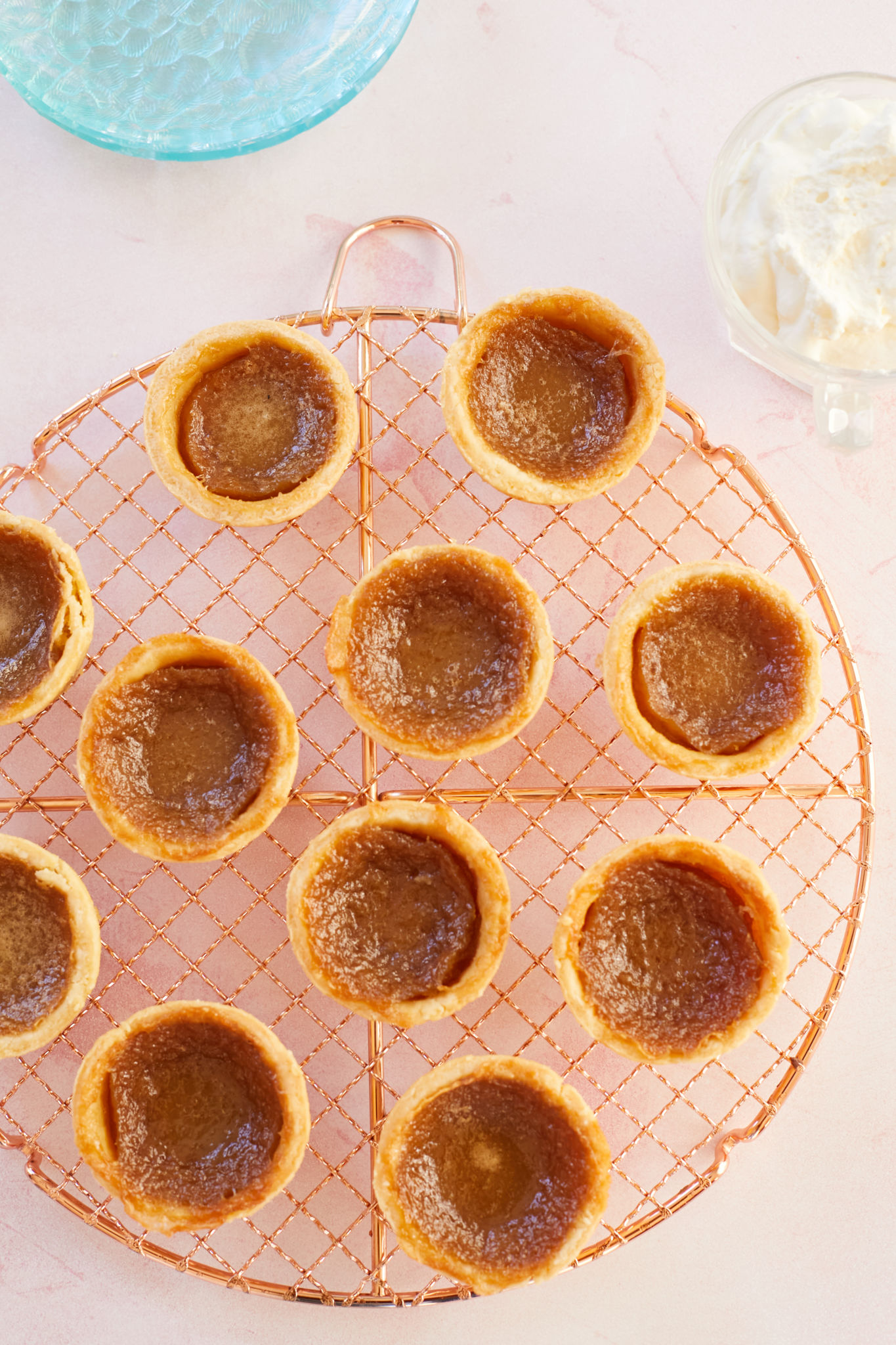 Top-down view of Canadian Butter Tarts on a cooling rack.