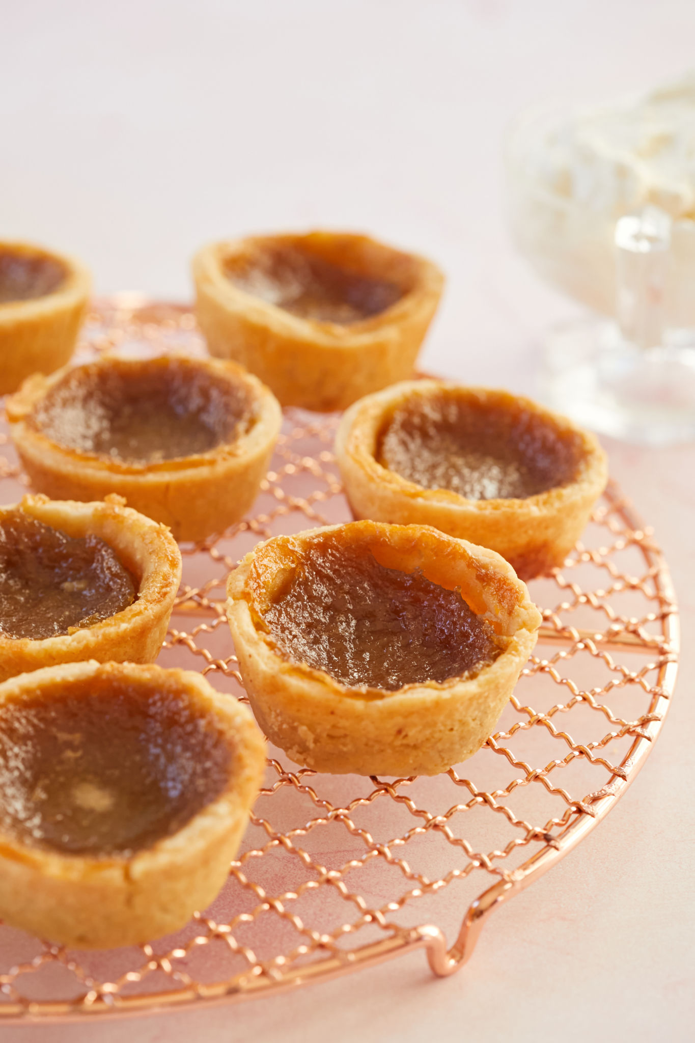 Canadian Butter Tarts arranged on a cooling rack.