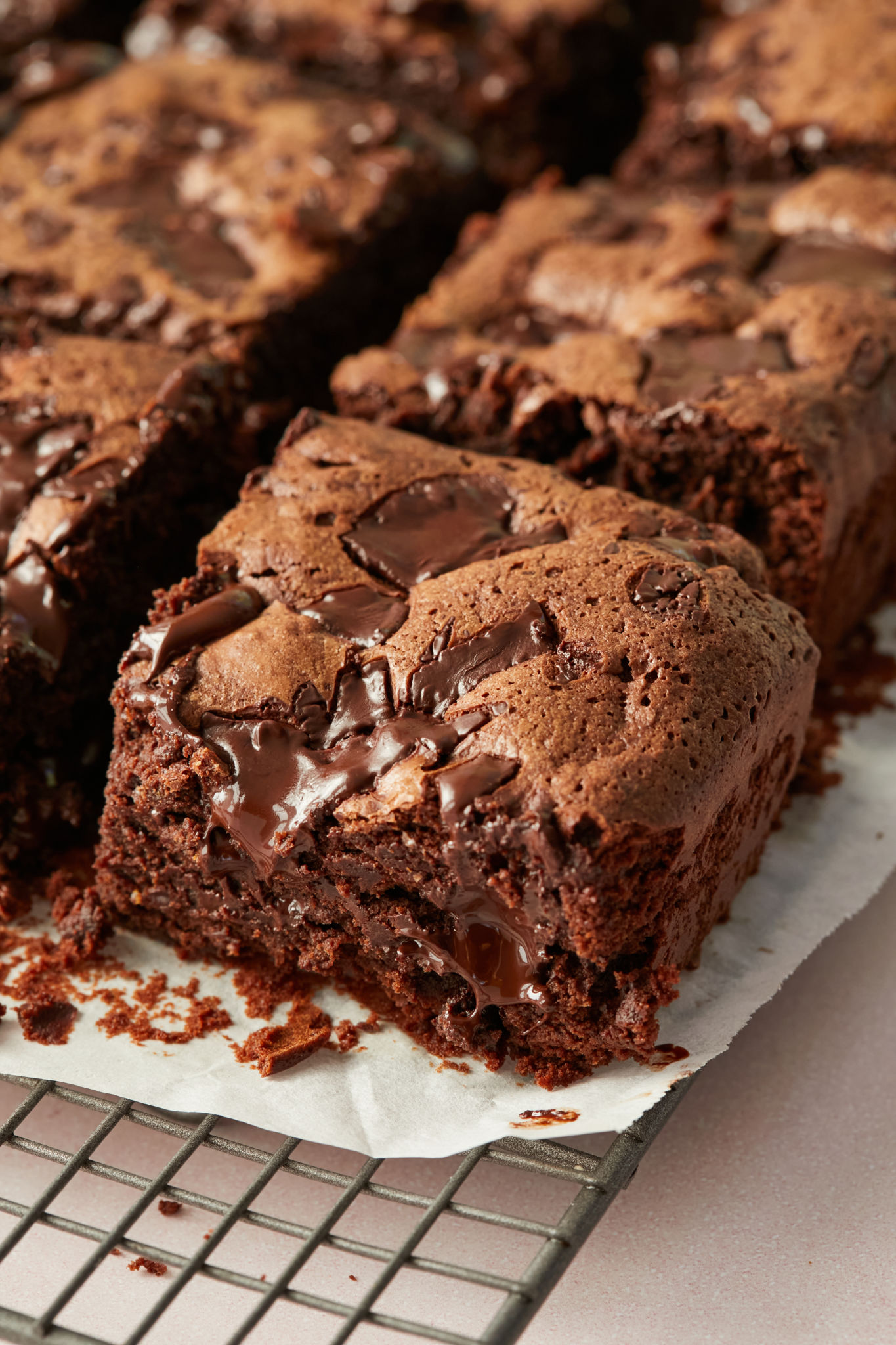 A close up of a chewy brownie with melted chocolate.