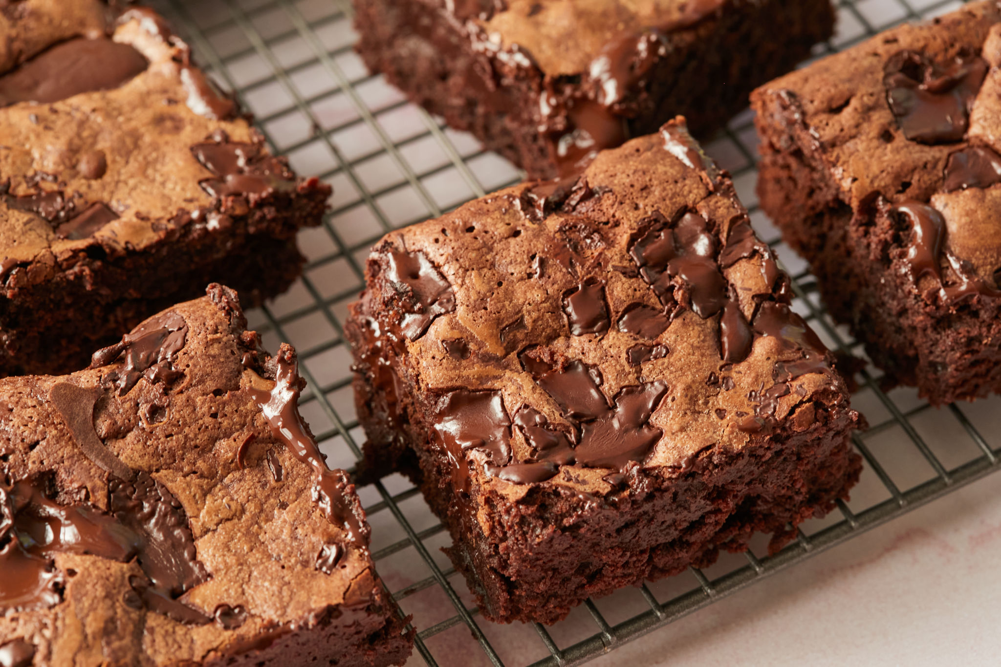 Chewy brownies on a cooling rack.