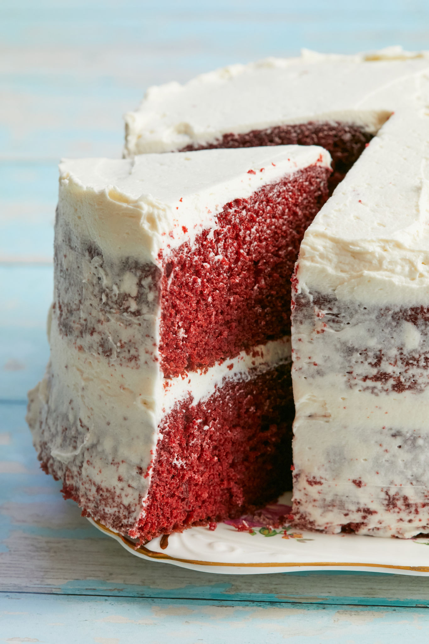 A slice of red velvet cake topped with my ermine frosting recipe.