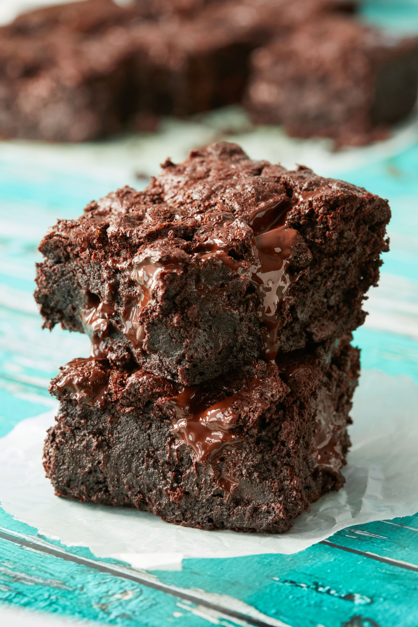 Two boxed brownies sitting on top of each other, showing texture and consistency.