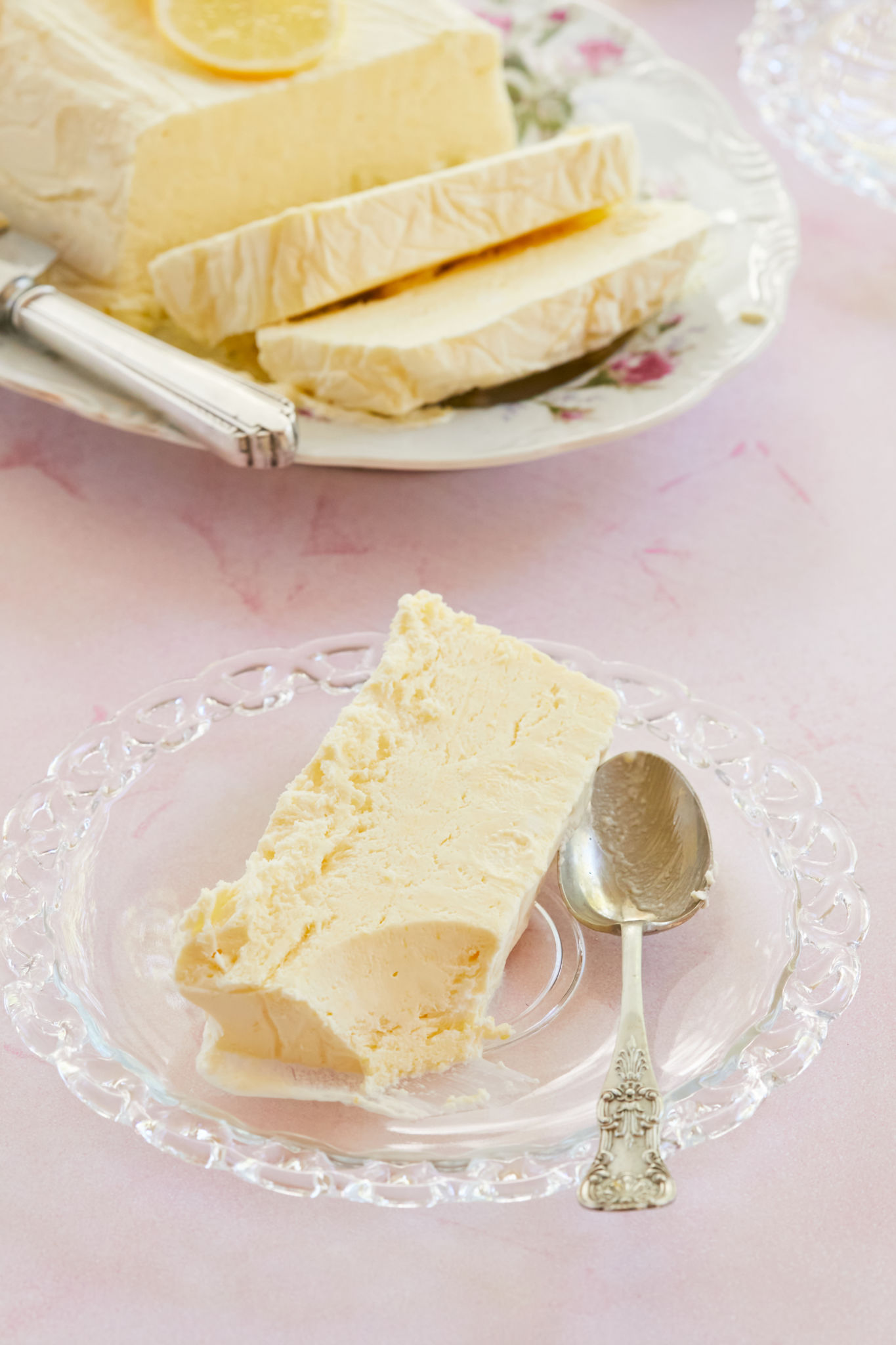 A slice of Lemon Semifreddo with a spoonful removed.