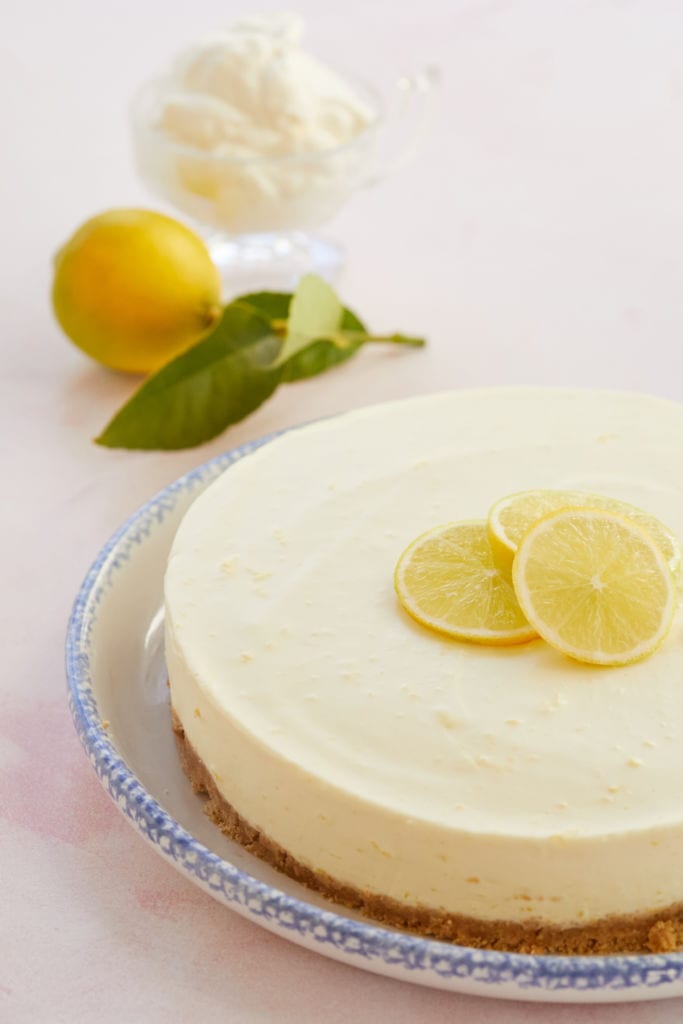 No-Bake Leon Cheesecake has a silky smooth filling with a buttery cookie crust, topped with fresh lemon slices.
