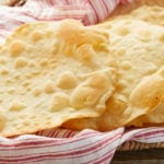 Homemade Olive Oil Matzah Crackers on a towel.