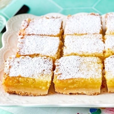 Easy Lemon Bars are cut into squares and dusted with powdered sugar.