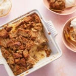 Banana Bread Pudding in a serving dish with two bowls.