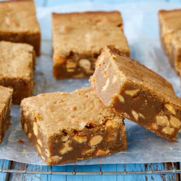 Generous squares of Best-Ever Blondies show their shiny, crinkly top and gooey center.