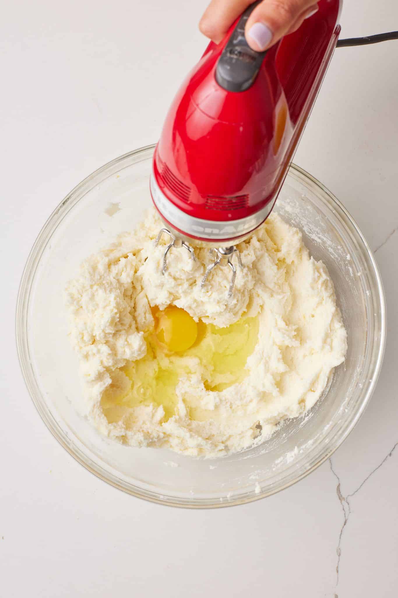 Whisk in eggs gradually. 