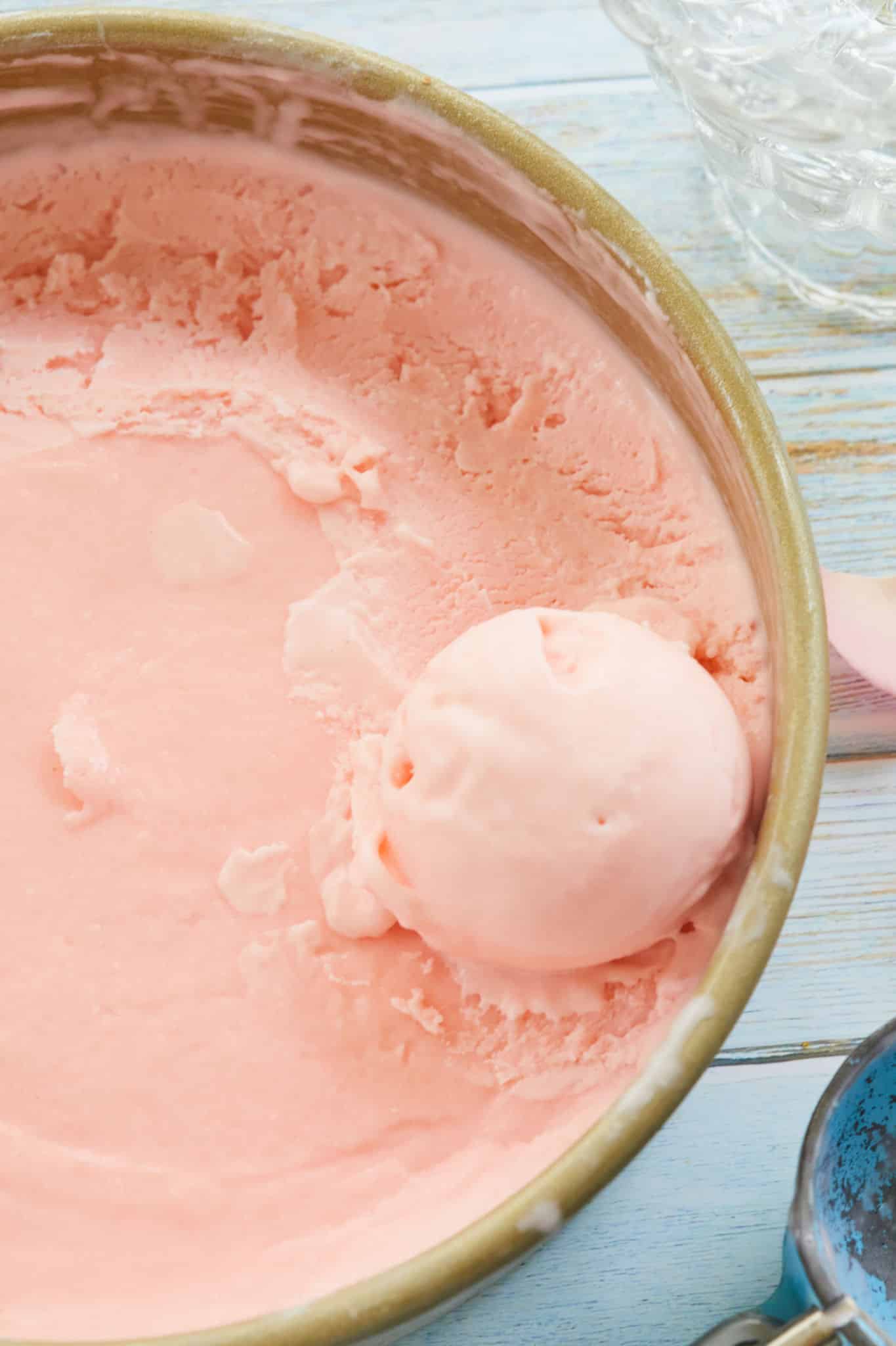 A scoop of Rosewater Gelato sitting in a tub.