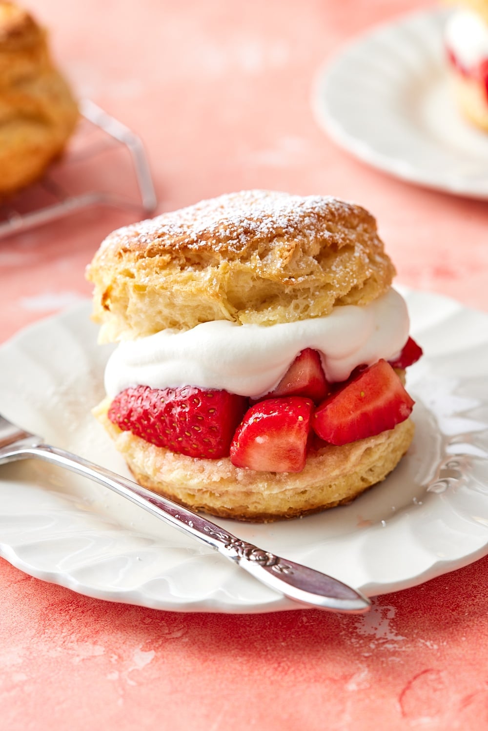 Strawberry Shortcake Recipe12.jpg Biscuit split in half filled with whipped cream and fresh strawberries.