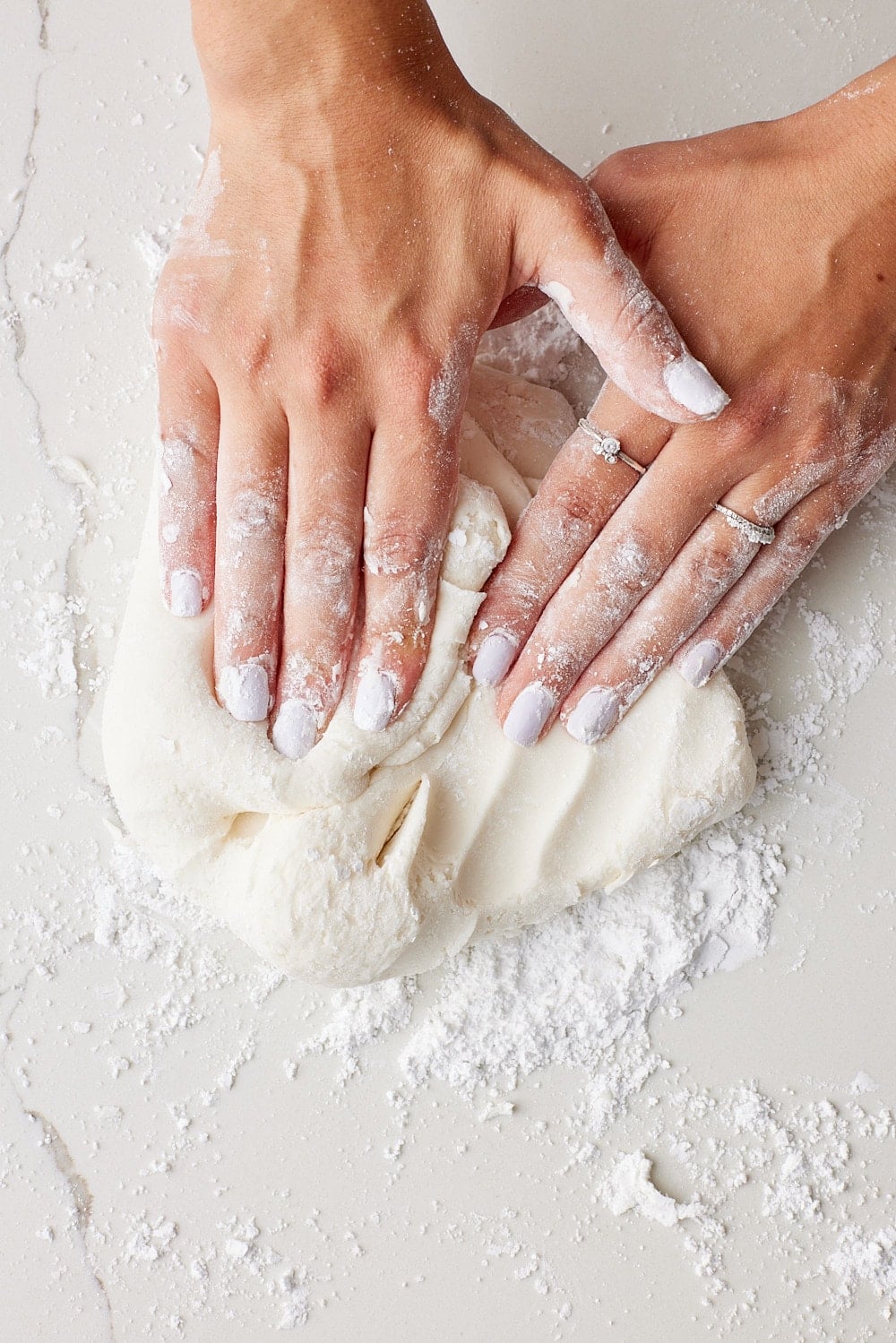 Fondant7 Turn out the fondant onto a clean surface and knead in the remaining powdered sugar until smooth and pliable.