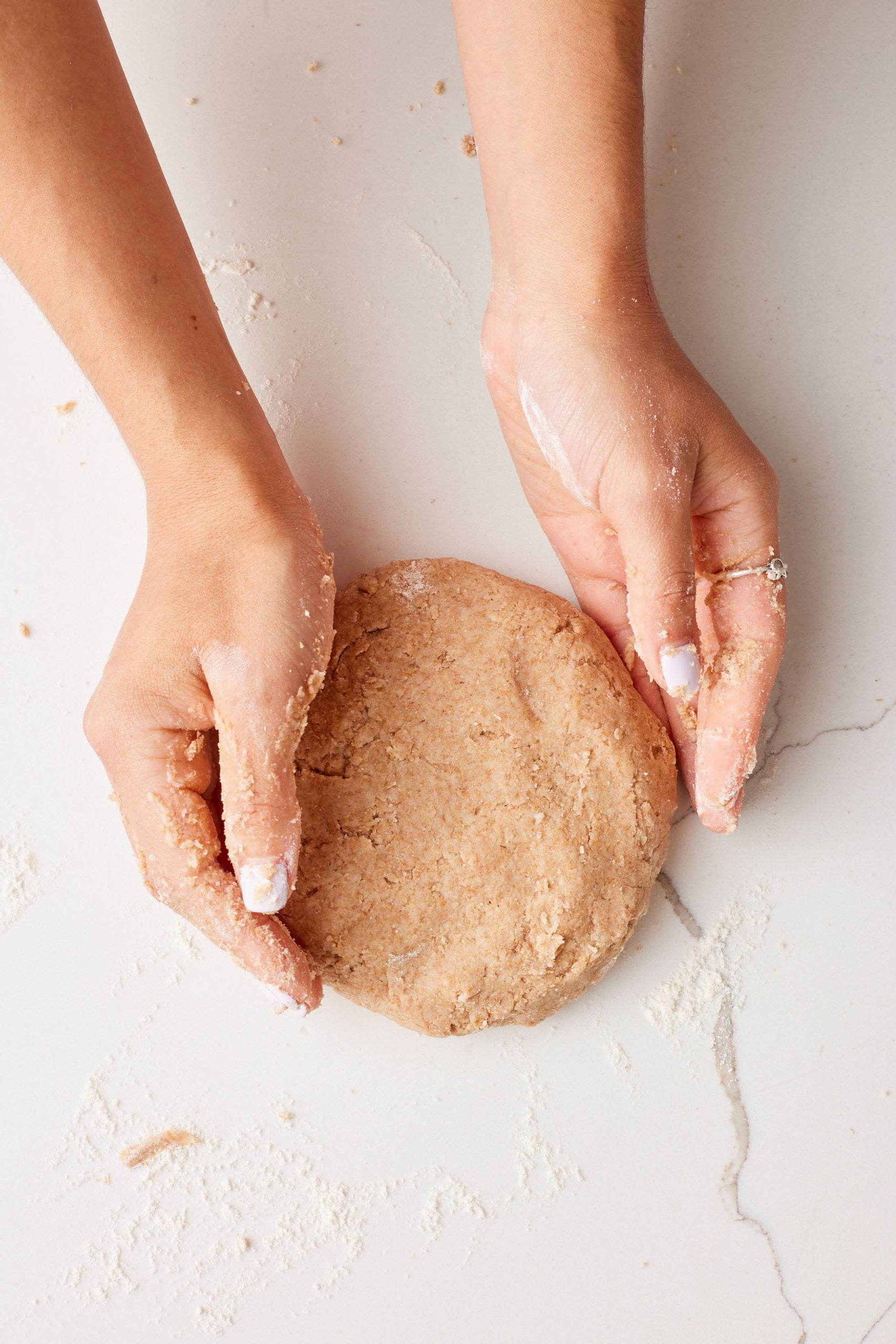 Roll the dough on a floured surface until smooth.