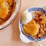 Apple Honey Cobbler in a bowl with ice cream.